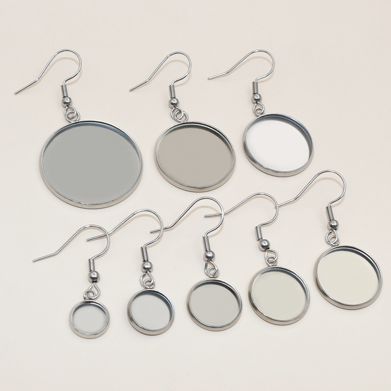 UNICRAFTALE 50 sets 8 mm platte ronde oorstekers voor het maken van oorbellen van 304 roestvrij staal met helder glas cabochons van metaal cabochon oorbellen voor het maken van sieraden