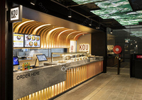 Comptoir de café en bois avec façade vitrée et éclairage LED pour usage commercial