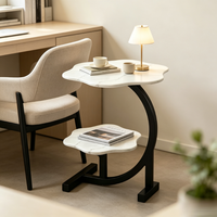 Table basse contemporaine en métal blanc crème avec plateau en métal, design sculpté à double couche creuse et support en boule solide Tenghang