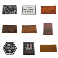 Étiquette en cuir marron personnalisée en PU avec logo en relief métallique pour vêtement