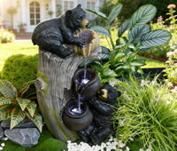 Deux sculptures d'ours noirs en résine avec fontaine à eau et lumières LED pour la décoration de jardin