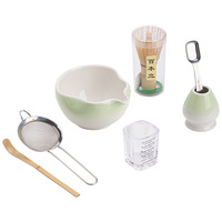 Ensemble de cérémonie du thé quatre pièces Nebula Matcha en céramique Dehua : Fouet à thé, Bol à thé avec couvercle, Tasse à thé à bec verseur, Support et Outils de cérémonie du thé de style Hyakumoto