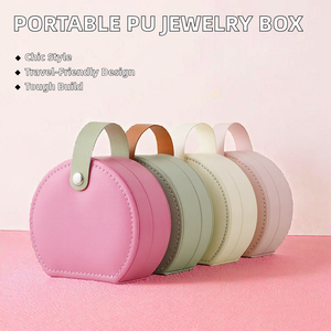Boîte à bijoux ronde de petite taille en cuir PU avec poignée, doublure en velours, fermeture à bouton, étui de rangement portable pour bijoux de voyage, vente en gros d'usine - Product Image 2