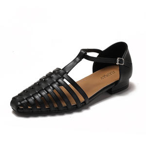 A <b>Woman</b> Wearing Retro <b>Roman</b> <b>Sandals</b> in Summer with Flat-bottomed Toe and Hollowed-out Woven Pig Cage Shoes - Product Image 4