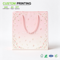 Sac en papier rose poudré imprimé sur mesure avec motif floral et poignée en corde torsadée pour mariage et emballage cadeau, vente en gros