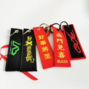 Wholesale Customized Remove Luggage Tag <b>Label</b> Before Embroidery Keyring Flight for logo Woven Keychains - Product Image 1