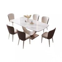 Table à manger de luxe effet marbre blanc avec base en U unique et 6 chaises de salle à manger