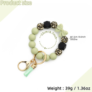 Silicone Beaded <b>Keychain</b> Bracelet With Daisy Charm And Carabiner Clasp In Pastel Colors - Product Image 2