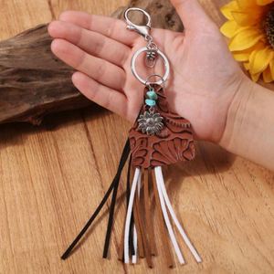 Tournesol géométrique Turquoise Tassel Horse Hair Diy Trendy Bohemia Handbag Porte-clés en cuir véritable fait à la main - Product Image 1