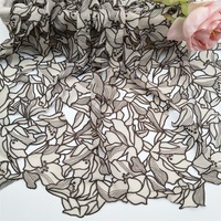Tissu en dentelle brodé au laser à deux couleurs, motif feuille, de haute qualité, en stock usine, à prix abordable, pour vêtements, échantillon gratuit disponible