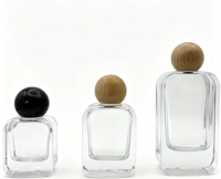 Flacon de parfum carré en verre transparent haut de gamme avec bouchon brillant, flacon rechargeable élégant et pulvérisateur à pompe de Jiangsu