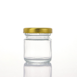 Vente en gros <span class=keywords><strong>pas</strong></span> <span class=keywords><strong>cher</strong></span> mini <span class=keywords><strong>pot</strong></span> <span class=keywords><strong>de</strong></span> miel <span class=keywords><strong>de</strong></span> forme ronde 25ml 35ml 55ml 75ml <span class=keywords><strong>petit</strong></span> <span class=keywords><strong>pot</strong></span> en verre avec couvercle en métal et louche en bois - Product Image 3