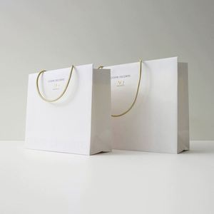 Factory Price High Quality Paper Shopping Handle Ribbon <b>Bag</b> Luxury Recyclable Paper <b>Bag</b> Cardboard <b>Gift</b> <b>Bags</b> Cosmetic Package - Product Image 1