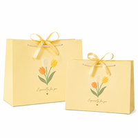 Sacs en papier blanc en gros, sacs d'emballage personnalisés pour les magasins de vêtements, les boutiques de cadeaux, la promotion de marques