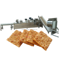 Ligne de production de barres granola Moxin, très demandée |   Machine automatique pour barres de céréales à l'avoine, au sésame et aux cacahuètes et mélangeur à nougat