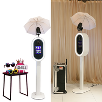 Photobooth DSLR à utilisation facile avec support flash supérieur, lumière LED RGB à télécommande et support iPad, livré avec flight case à roulettes pour festivals