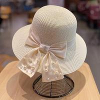 Vente en gros de chapeaux de soleil d'été pour femmes chapeau de paille de plage à large bord avec nœud décoratif en perles pour la pêche et les activités de plein air