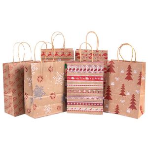 Bolsas de Regalo de Papel Kraft Marrón Reciclado Marca XYK con Impresión Flexográfica de Papá Noel, Copos de Nieve, Puntos, Rayas y Árbol de Navidad - Product Image 1
