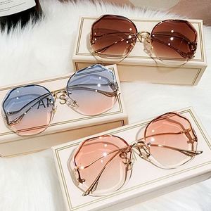 Gafas de Sol Redondas Irregulares con Degradado para Mujer, Logotipo Personalizado, Venta al Por Mayor, Montura Metálica Sin Aro, Patillas Curvas - Product Image 1