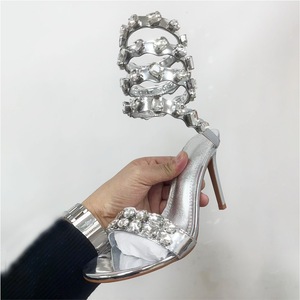 Sandalias de tacón de aguja con diseño serpentina de primavera para mujer, estilo europeo-americano, con punta abierta y parte superior de cachemira (ante de oveja), directas de fábrica. - Product Image 1