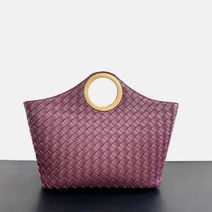 The New Circular <b>Tote</b> <b>Bag</b> with a High-end Feel, a Fashionable Large-capacity <b>Bag</b> Made of Cowhide and a <b>Woven</b> Handbag - Product Image 1