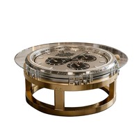 La table basse au design moderne avec une base en métal doré et un dessus en verre transparent est un ajout idéal