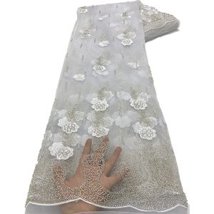 Compre a granel <span class=keywords><strong>tela</strong></span> <span class=keywords><strong>de</strong></span> encaje africano telas <span class=keywords><strong>de</strong></span> encaje <span class=keywords><strong>de</strong></span> <span class=keywords><strong>tul</strong></span> con cuentas <span class=keywords><strong>de</strong></span> lentejuelas <span class=keywords><strong>de</strong></span> alta calidad para vestido <span class=keywords><strong>de</strong></span> novia - Product Image 1