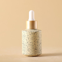 Bouteilles en verre givré de luxe écologiques avec couvercle argenté 30 ml pour emballage d'huiles essentielles et compte-gouttes de sérum