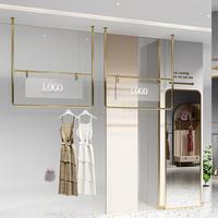 Porte-vêtements mural personnalisé avec logo, en acier inoxydable, pour boutique de vêtements pour enfants, présentoir de robes pour femmes, présentoir professionnel