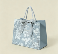 Sac fourre-tout en papier de luxe recyclable à motif floral imprimé quadricolore avec fermeture magnétique, poignée en corde et nœud en ruban pour mariage et fêtes