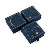 Boîte à bijoux personnalisée bleu nuit avec motif de traînée d'étoiles, emballage coulissant avec bordure dorée pour cadeaux de détail, marques de cadeaux en gros