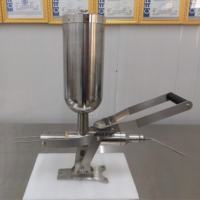 Machine manuelle de remplissage de crème pour choux à la crème, pâte de cacahuète, confiture, chocolat, gâteaux, pains et beignets