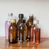 Étiquettes personnalisées emballage de qualité alimentaire ambre clair vide distributeur de médicaments maigres sirop toux bouteilles en verre oral avec bouchon à l'épreuve des enfants