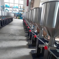 Machine de remplissage manuelle de liquides pour bouteilles en plastique et en verre de cosmétiques, chocolat et boissons