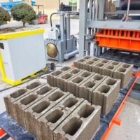 Machine de fabrication de blocs de béton hydraulique entièrement automatique QT4-15 pour briques creuses, autobloquantes et de pavage en ciment de 4, 6 et 8 pouces
