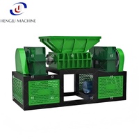 Broyeur industriel double à couple élevé pour la recyclage des déchets métalliques, des tuyaux en plastique, du bois et des pneus, avec démarrage et arrêt automatiques