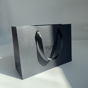 Bolsas de papel negro de lujo al por mayor, bolsas de regalo con asa de cinta de satén negra y logotipo UV personalizado para ropa, ropa interior y boutiques. - Product Image 3