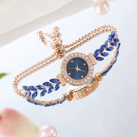 Nouvelle montre-bracelet élégante et décontractée pour femme avec un joli cadran rond, dotée d'un bracelet en forme de feuille et de plume N2604198