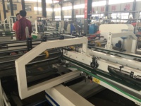 Machine automatique de pliage et de collage de boîtes en carton ondulé