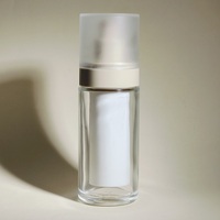Flacon en verre sans air cylindrique imprimé à l'écran sérigraphique à surface brillante de 15/30/50 ml, pompe à pression, emballage MOC, crème de soin de la peau, emballage cosmétique
