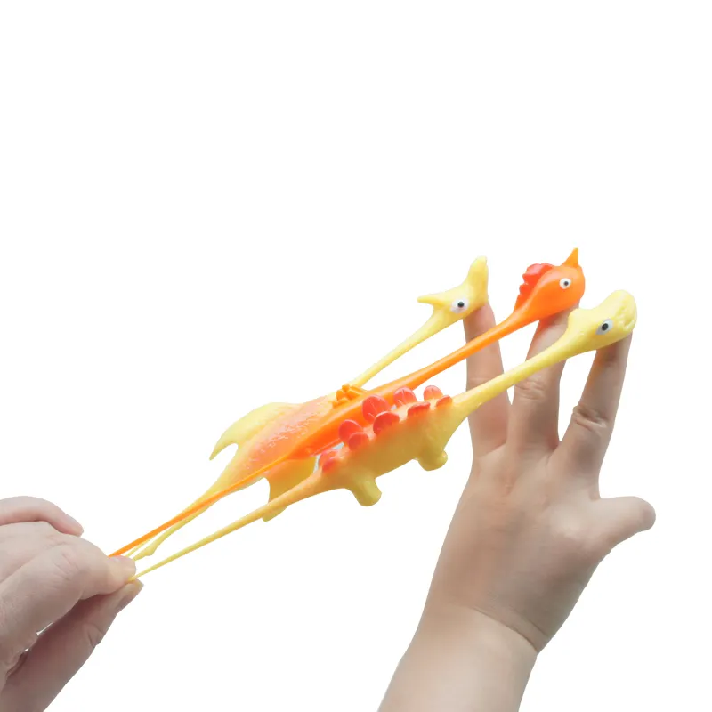 Hot Sale TPR Material High Quality Promotion TPR Dinosaur Toy Slingshot Catapult Toys Small Children Toys