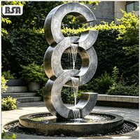 Fontaine d'eau artistique à trois anneaux empilés en acier inoxydable brossé 304/316L, style abstrait moderne BSA, pour villa, cour et jardin