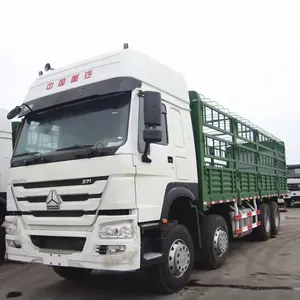 SINOTRUK HOWO 8X4 371HP 35T CARGO TRUCK WITH SIDEWALL AND FENCE GREEN COLOR ZZ1317N4667V