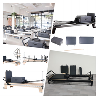 Reformer de Pilates en aluminium blanc, modèle Studio Infinity Bar, avec structure coulissante en aluminium blanc