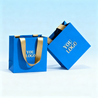 Sac en papier bleu de luxe personnalisé avec logo pour boutique de détail, en papier couché avec impression numérique, design de logo personnalisé