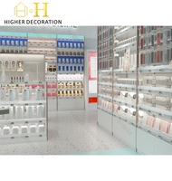 Meuble de présentation de comptoir de magasin de détail vert menthe et rose corail pour maquillage, vitrine de présentation de maquillage