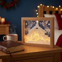 Veilleuse de Noël 3D en papier découpé sur fond bleu foncé avec cadre en bois, décoration de maison de Noël