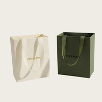 Sacs en papier d'art de luxe personnalisés pour vêtements, bijoux et artisanat utilisés dans des emballages de luxe à texture épaisse avec logo personnalisé