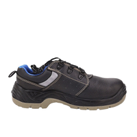 Chaussures de sécurité basses en cuir gaufré pour homme, avec embout en acier et maille double couche, semelle extérieure en PU anti-perforation, idéales pour l'usine et le travail.
