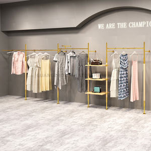 Gli scaffali dorati della <span class=keywords><strong>parete</strong></span> dell'esposizione dello scaffale di esposizione dei vestiti fissato al muro della Boutique appendono l'acciaio inossidabile per il negozio di abbigliamento - Product Image 2